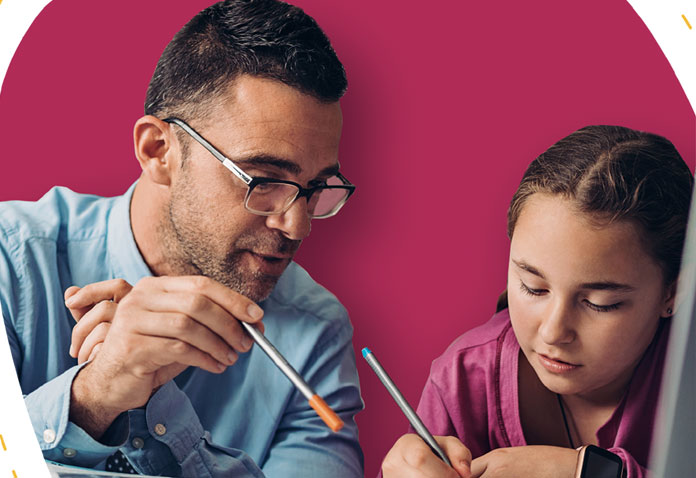 Man helping girl write